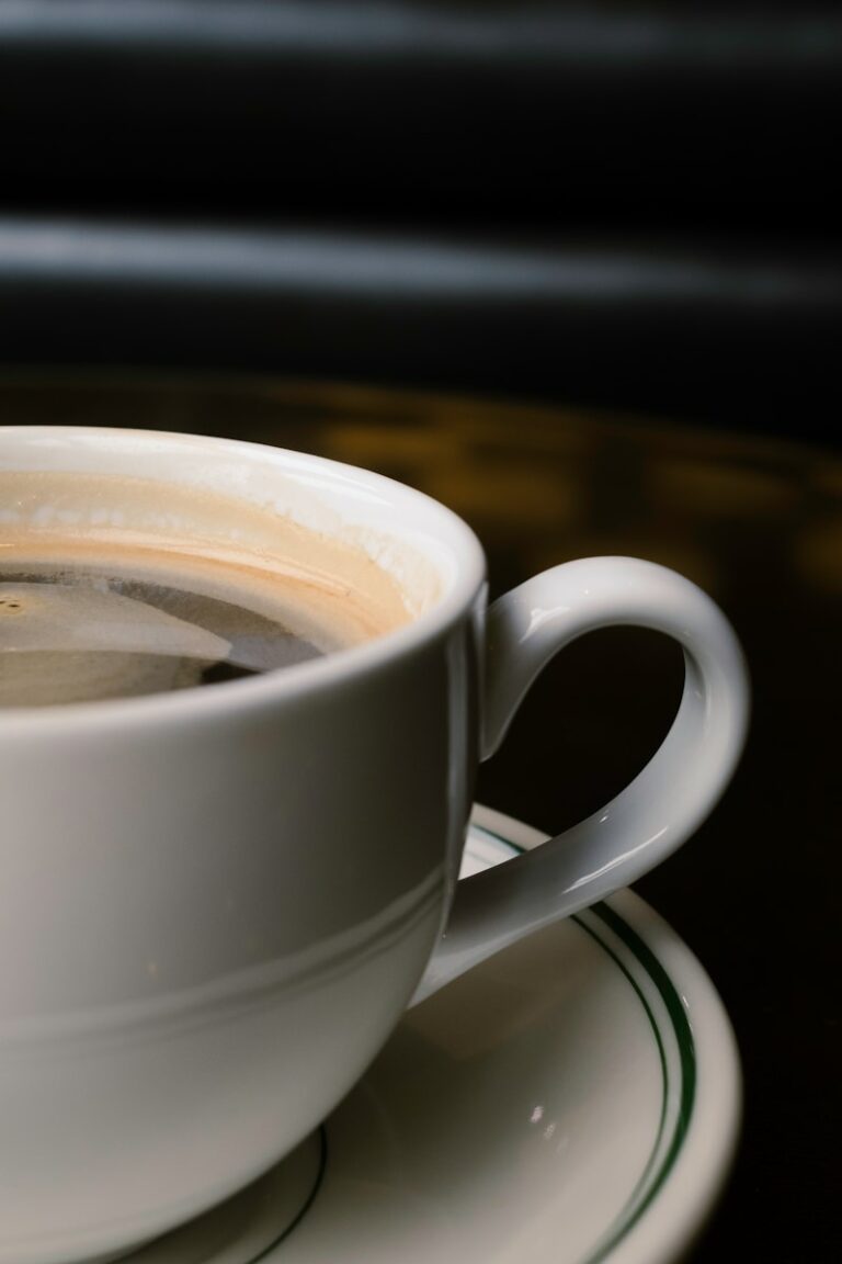 white ceramic teacup with saucer